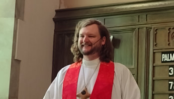 Pastor Travis Preaching from the Pulpit